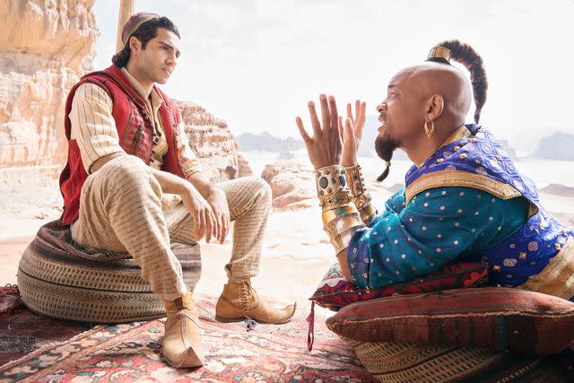 Walt Disney Studios Motion Pictures / courtesy Everett Collection Mena Massoud and Will Smith in <em>Aladdin</em> (2019)
