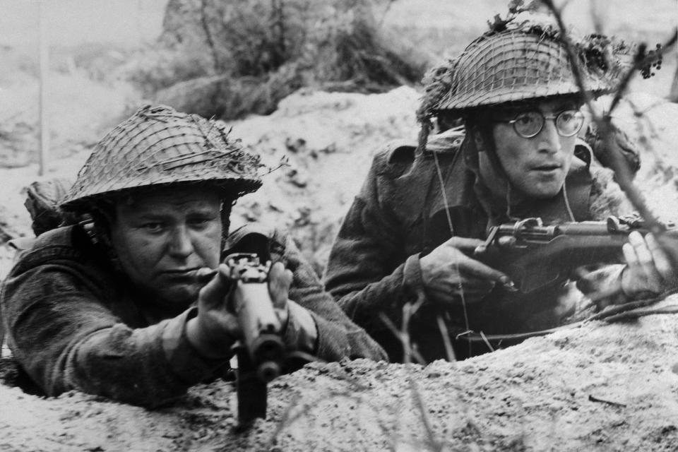 (Original Caption) Beatle John Lennon (right) and Roy Kinnear play members of a British Platoon caught up in World War II's north Africa campaign in United Artists' How I Won the War, directed by Richard Lester.