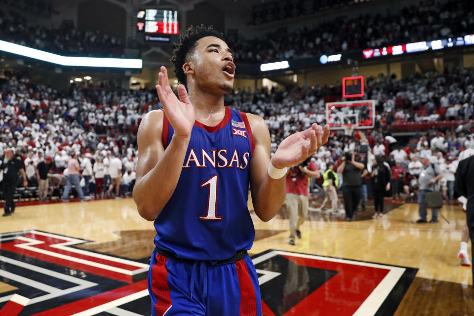 Kansas' Devon Dotson (1) celebrates after an NCAA college basketball game against Texas Tech, Saturday, March 7, 2020, in Lubbock, Texas. (AP Photo/Brad Tollefson)