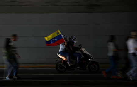 Opposition supporters take part in a rally against Venezuelan President Nicolas Maduro's government in Caracas, Venezuela February 2, 2019. REUTERS/Carlos Barria