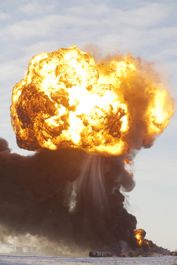 Mandatory Credit: Photo by ZUMA/REX (3452782a) A massive fireball from an exploding train car rises into the air just west of Casselton. Train collision ignites an oil tankers in North Dakota, America - 30 Dec 2013 The freight train was carrying 110 cars and went off the tracks west of Casselton and was hit by a second train. There were no reports of injuries from the accident. 