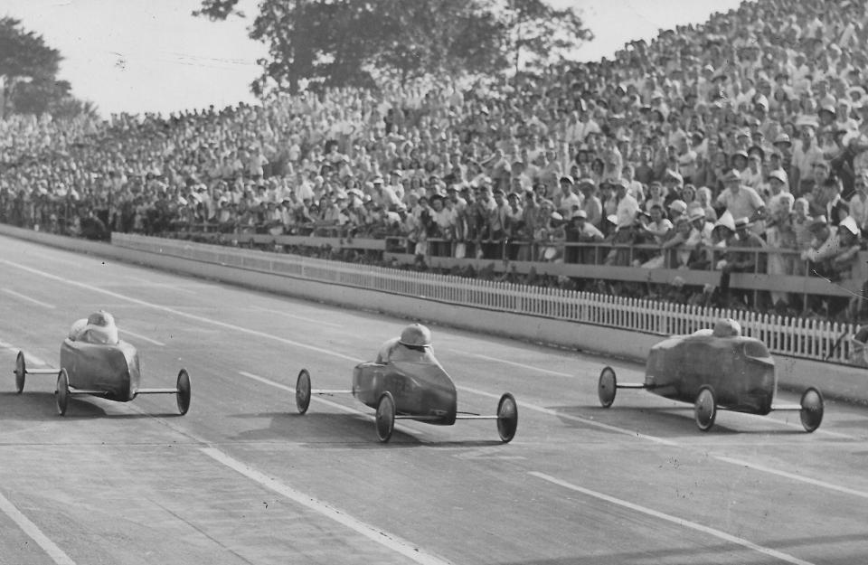 Racers speed downhill toward the finish line during the 1947 All-American Soap Box Derby in Akron.