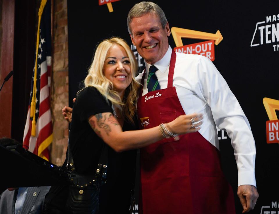 President of In-N-Out Burger Lynsi Snyder hugs Governor Bill Lee after giving him a In-N-Out Burger apron after Lee announces that the restaurant will be coming to Tennessee during a press conference at Franklin, Tenn., Tuesday, Jan. 10, 2023. 