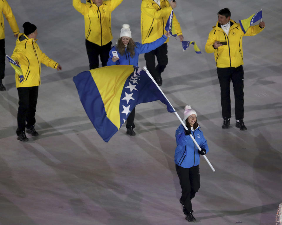 <p>Elvedina Muzaferija carries the flag of Bosnia And Herzegovina during the opening ceremony of the 2018 Winter Olympics in Pyeongchang, South Korea, Friday, Feb. 9, 2018. (Sean Haffey/Pool Photo via AP) </p>