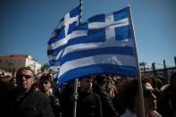 Locals, who oppose the building of a new closed migrant detention centre, take part in a demonstration in the city of Mytilene, on the island of Lesbos