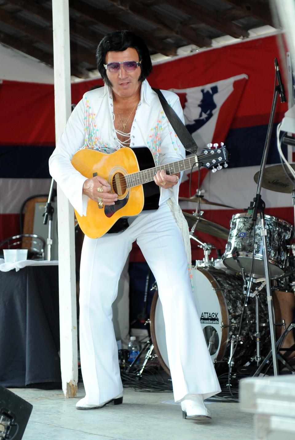 Mike Albert performs as Elvis Presley in 2011 during a concert at the Coshocton County Fairgrounds in Ohio.