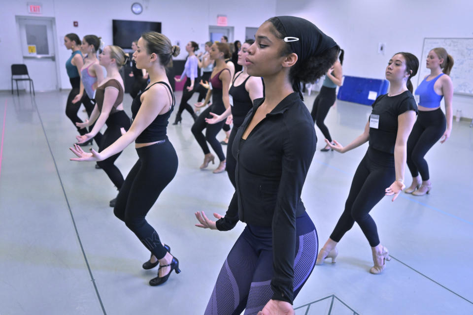 Boston Conservatory at Berklee student Rhapsody Stiggers, foreground, of St. Paul, Minn., takes part in a Rockettes Precision Dance Technique course Wednesday, Feb. 8, 2023, at the Boston Conservatory at Berklee in Boston. (AP Photo/Josh Reynolds)