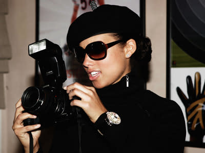 <p>Alicia Keys uses a photographer?s camera in the Green Room before performing at the NEXT House Host ESPN The Magazine - Alicia Keys Charity Event on February 5, 2005 in Jacksonville, Florida.</p>