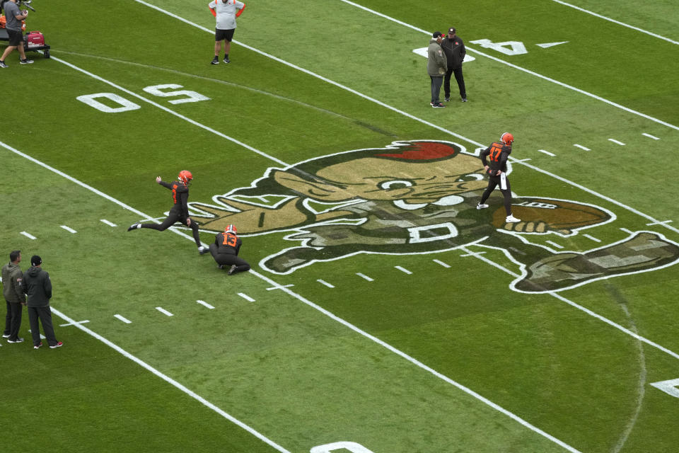 Remnants of tire tracks made by a person who broke into First Energy Stadium earlier this week and drove a vehicle around the field, can be seen during team warm ups before an NFL football game between the Cleveland Browns and the Tampa Bay Buccaneers in Cleveland, Sunday, Nov. 27, 2022. (AP Photo/Gene J. Puskar)