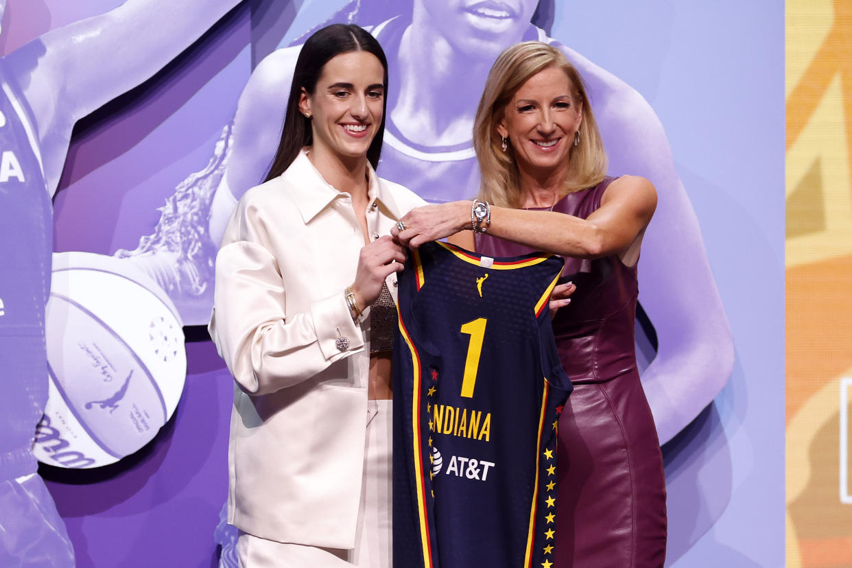 NEW YORK, NEW YORK - APRIL 15: Caitlin Clark poses with WNBA Commissioner Cathy Engelbert after being selected first overall pick by the Indiana Fever during the 2024 WNBA Draft at Brooklyn Academy of Music on April 15, 2024 in New York City. (Photo by Sarah Stier/Getty Images)