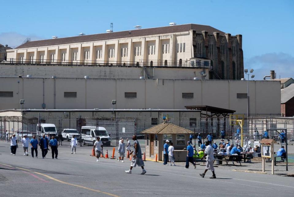 Inmates exercise outside in the yard at San Quentin State Prison in San Rafael on July 26, 2023. Republicans and moderate Democrats have repeatedly tried to expand offenses that would fall under the three-strikes law, but the deep-blue Legislature has typically shut down these efforts.