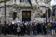 Demonstrators gather outside Australia House to protest against the extradition of Wikileaks founder Julian Assange, in London, Saturday, Feb. 22, 2020. Assange is fighting extradition to the United States on spying charges.(AP Photo/Alberto Pezzali)