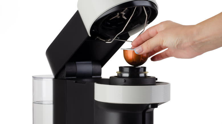 taking capsule out of nespresso machine