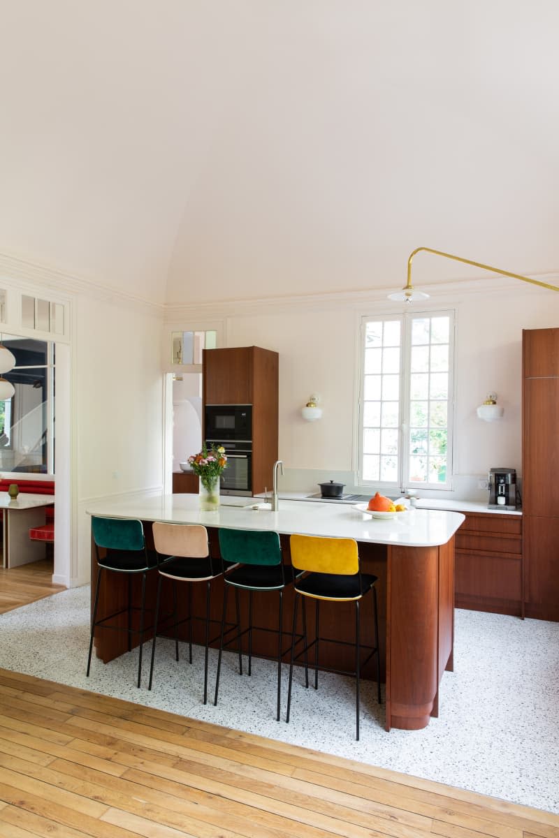 Colorful bar stools in newly renovated kitchen.