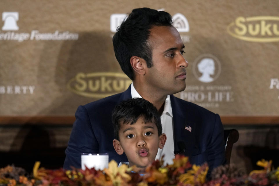 Republican presidential candidate businessman Vivek Ramaswamy holds his three-year old son Karthik as he speaks during the Family Leader's Thanksgiving Family Forum, Friday, Nov. 17, 2023, in Des Moines, Iowa. (AP Photo/Charlie Neibergall)