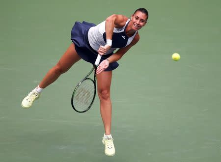 Flavia Pennetta of Italy serves to Simona Halep of Romania during their women's singles semi-final match at the U.S. Open Championships tennis tournament in New York, September 11, 2015. REUTERS/Carlo Allegri Picture Supplied by Action Images
