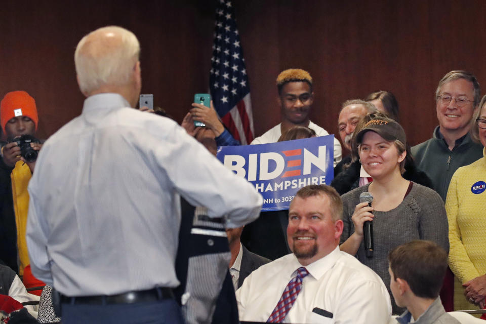 FILE- In this Feb. 9, 2020 file photo, Democratic presidential candidate and former Vice President Joe Biden listens to a question from Madison Moore, at right with microphone, at a campaign event in Hampton, N.H. Moore asked Biden to explain his underperformance in Iowa. After asking Moore if she'd ever been to a caucus, Biden called her "a lying, dog-faced pony soldier." Biden's comment holds the number nine position on the Yale Law School librarian's list of the most notable quotes of 2020. (AP Photo/Elise Amendola, File)