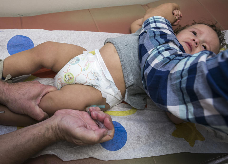 Pediatrician Charles Goodman vaccinates 1-year-old Cameron Fierro with the MMR vaccine. (Photo: AP Photo/Damian Dovarganes,File)