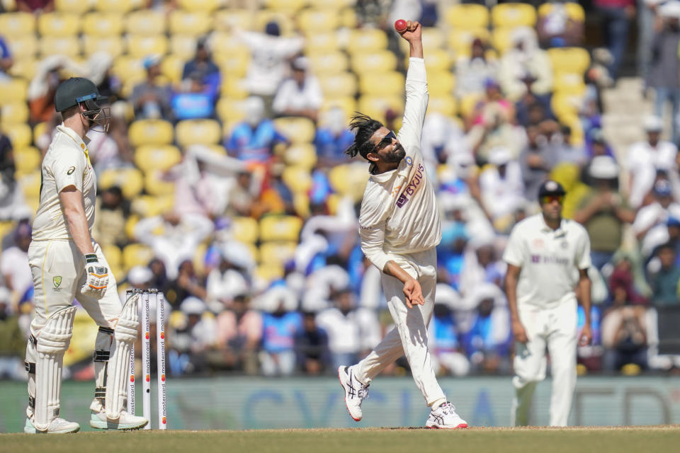 India's Ravindra Jadeja, center, bowls a delivery during the third day of the first cricket test match between India and Australia in Nagpur, India, Saturday, Feb. 11, 2023. (AP Photo/Rafiq Maqbool)