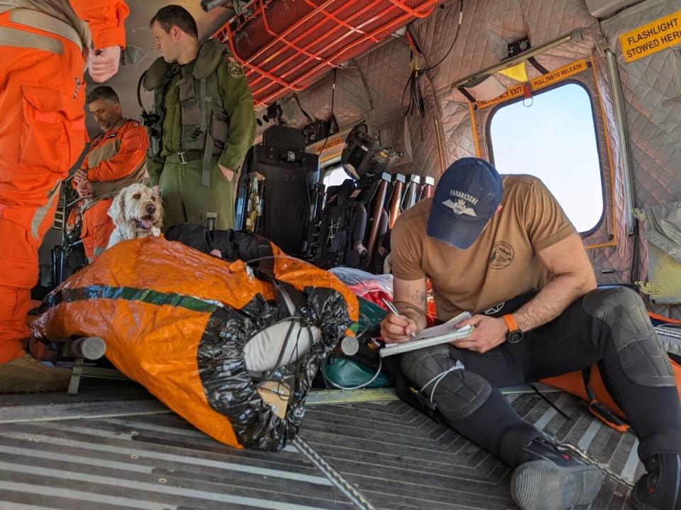 Two men were suffering from hypothermia after their boat capsized off the coast of Powell River, B.C., leaving them in the icy Pacific Ocean for 45 minutes. (Canadian Armed Forces - image credit)