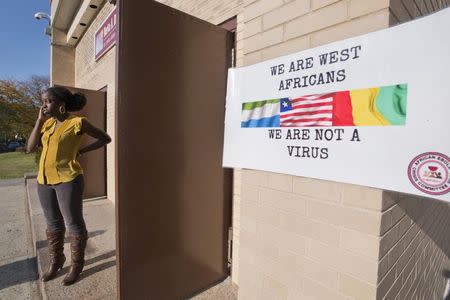 Freda Koomson, project coordinator and health consultant for the African Ebola Crisis Committee, speaks on her phone while attending "A Staten Island Ebola Summit" at Berta A. Dreyfus Intermediate School 49 in the Staten Island borough of New York October 25, 2014. REUTERS/Darren Ornitz