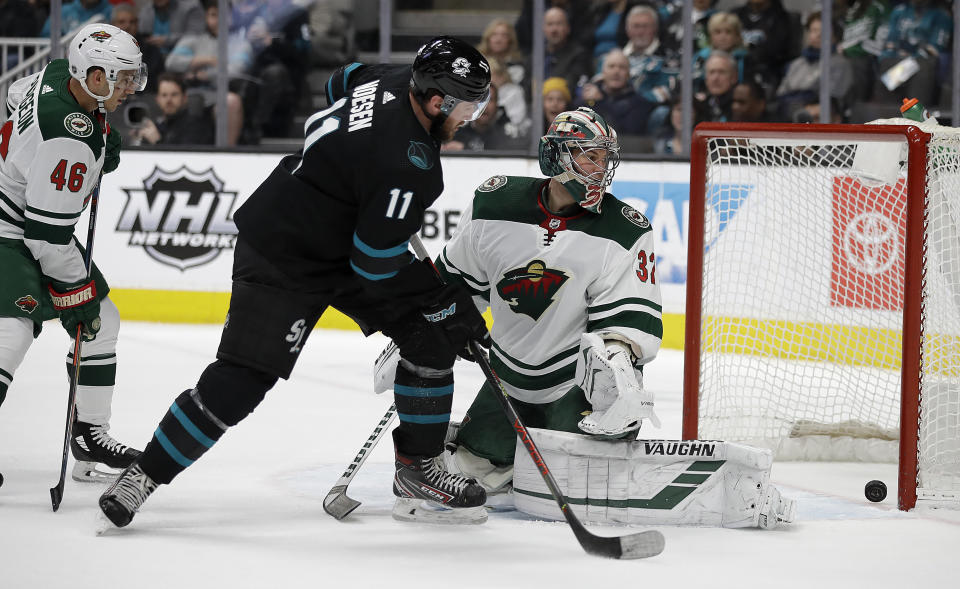 San Jose Sharks' Stefan Noesen (11) scores against Minnesota Wild goalie Alex Stalock, right, during the first period of an NHL hockey game Thursday, March 5, 2020, in San Jose, Calif. (AP Photo/Ben Margot)