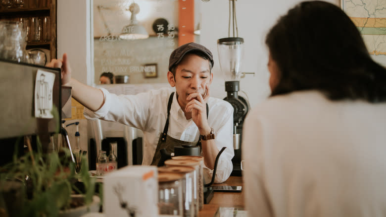 male barista taking order