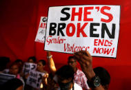 People shout slogans and hold placards during a protest against the rape of an eight-year-old girl, in Kathua, near Jammu and a teenager in Unnao, Uttar Pradesh state, in Mumbai, India April 13, 2018. REUTERS/Francis Mascarenhas