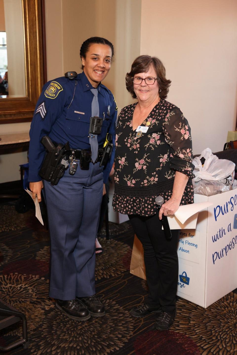 Michigan State Trooper Cabria Shirley (left) is shown with Lynn Uveges, president of the Soroptimist International of the Flat Rock Area.