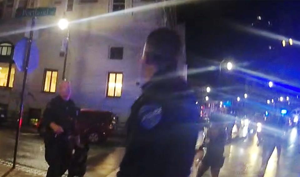 Worcester Police Officer Shawn Tivnan and his police dog, left, are seen in body camera footage following the Oct. 26, 2019 arrest of Christopher Ayala-Melendez at the Beer Garden on Franklin Street. 