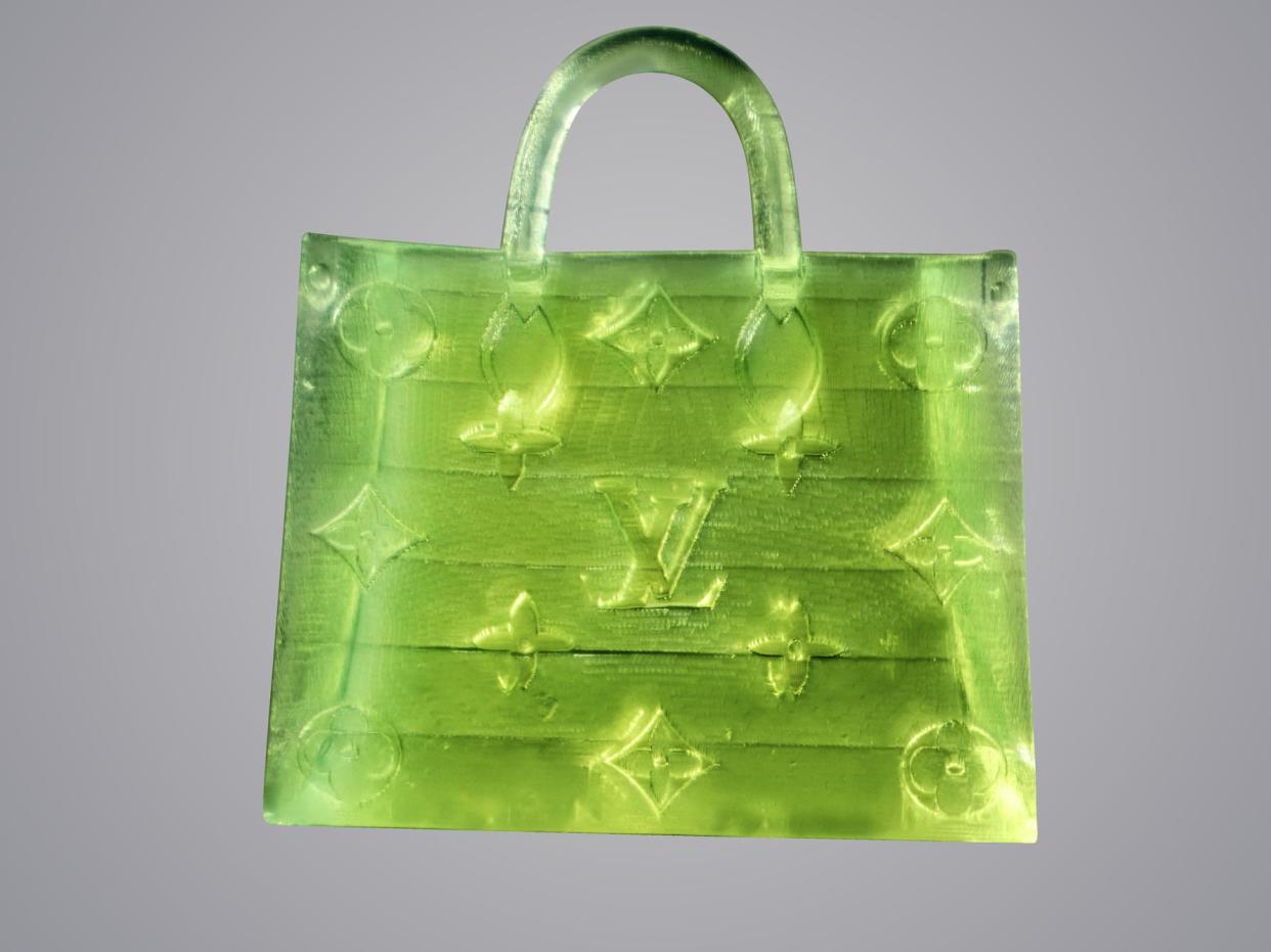 MSCHF's Microscopic handbag based on the Louis Vuitton OnTheGo Monogram bag.