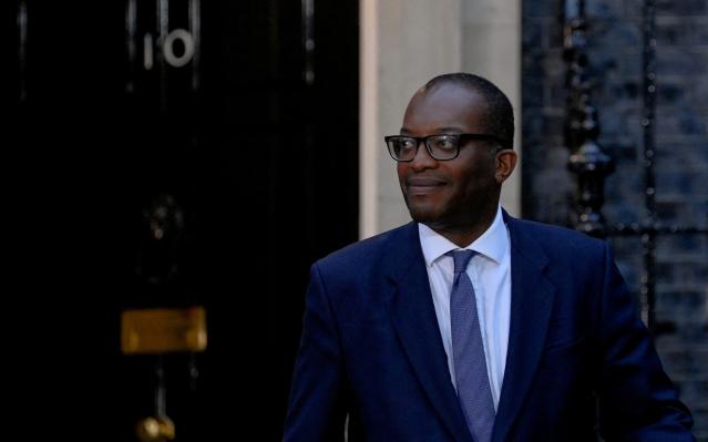 New British Chancellor of the Exchequer Kwasi Kwarteng walks outside Number 10 Downing Street, in London, Britain September 6, 2022 - TOBY MELVILLE/ Reuters