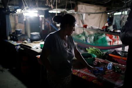 Maria Gonzalez, sister of Salvadoran migrant Marvin Antonio Gonzalez, who recently died in a border detention center in New Mexico, is pictured at her home in Verapaz