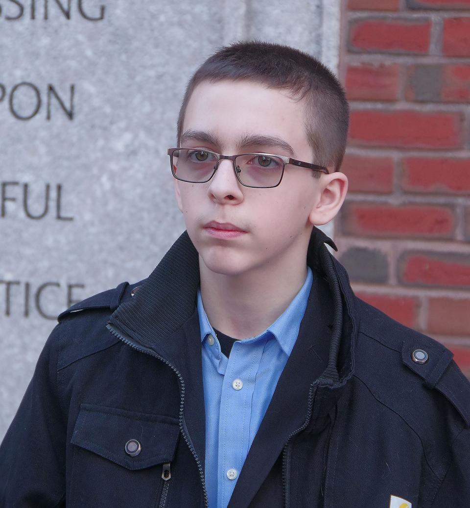 Eighth-grader Liam Morrison of Middleboro, Massachusetts, stands outside the courthouse after oral arguments in the U.S. Court of Appeals for the First Circuit in Boston on Thursday morning, Feb. 8, 2024. Morrison is appealing a lower court ruling that said he does not have a First Amendment right to wear a "There are only two genders" T-shirt to school.