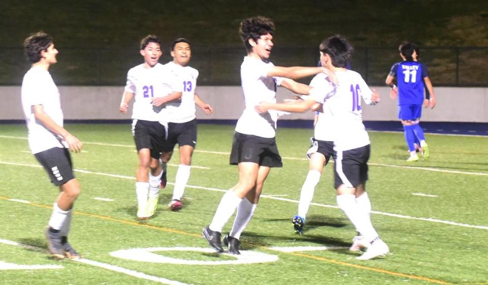 Pacheco HIgh senior Erwin Cervantez (18) celebrates with his teammates after he scored a goal against Valley High in the Sac-Joaquin Section Division III championship game at Cosumnes River College in Sacramento on Thursday, Feb. 22, 2024.