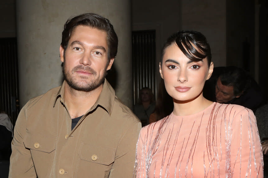 Craig Conover and Paige Desorbo sitting together at the Cucculelli Shaheen fashion show