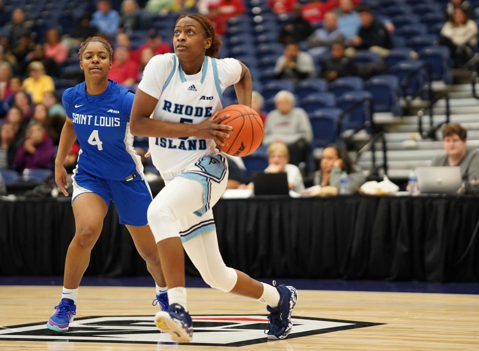 URI guard Teisha Hyman heads to the hoop against St. Louis defender Kennedy Calhoun in the first half of Saturday's Atlantic 10 semifinal in Henrico, Va.