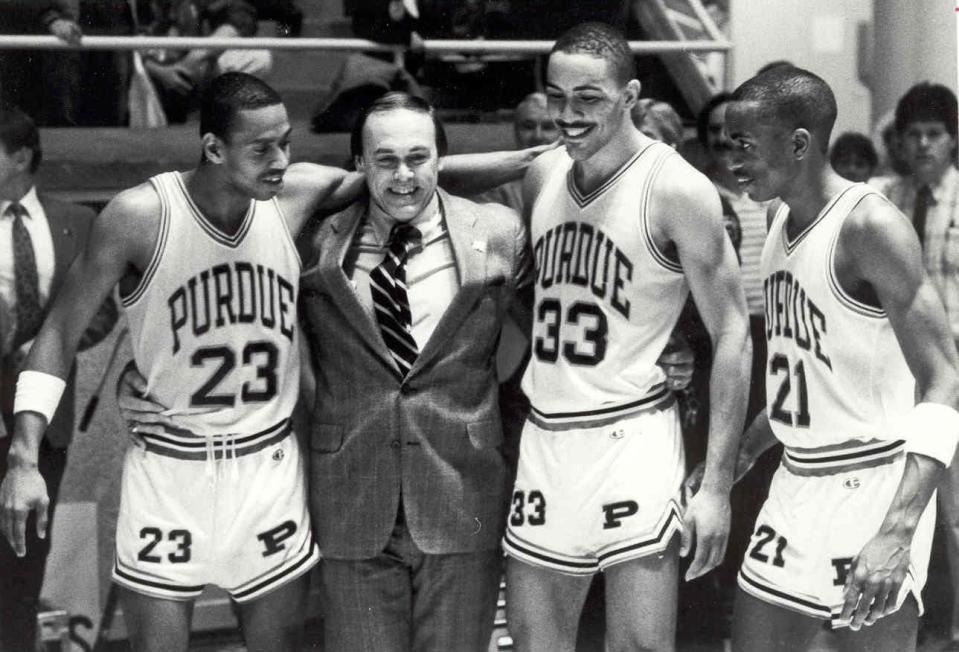 Purdue coach Gene Keady celebrates the 1988 Big Ten championship with, 
from left, Troy Lewis, Todd Mitchell and Everette Stephens.