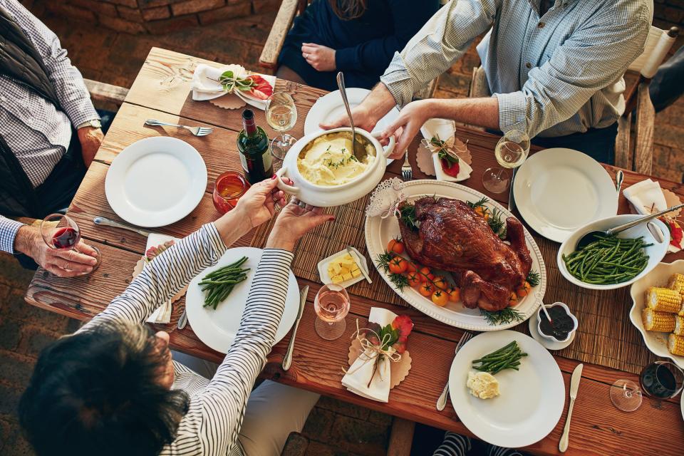 Enjoying a Thanksgiving dinner may be safer outside this year, but passing dishes around among members of different households is not recommended.