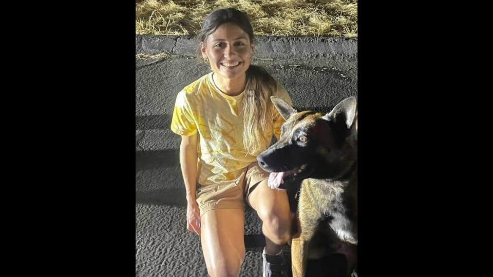 Camryn Escoto poses in Fresno with Odin, a Madera County Sheriff’s Office K-9 who went missing on Sunday, July 2, 2023.