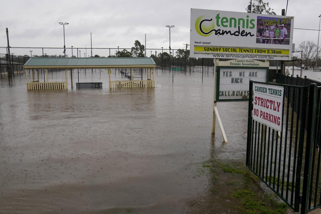 This photos shows a flooded sports venue in Camden on the outskirts of Sydney, Australia, Monday, July 4, 2022.