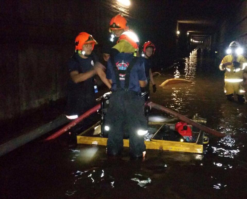 SCDF personnel clearing the flooded MRT tunnel during October’s flooding incident. (PHOTO: SCDF)