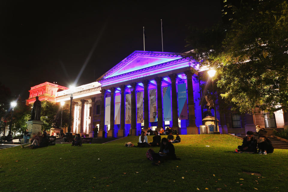 The colors of the Union Jack, the national flag of the United Kingdom, are projected onto the Victoria State Library as a tribute to Manchester Bombing victims in Melbourne, Australia.