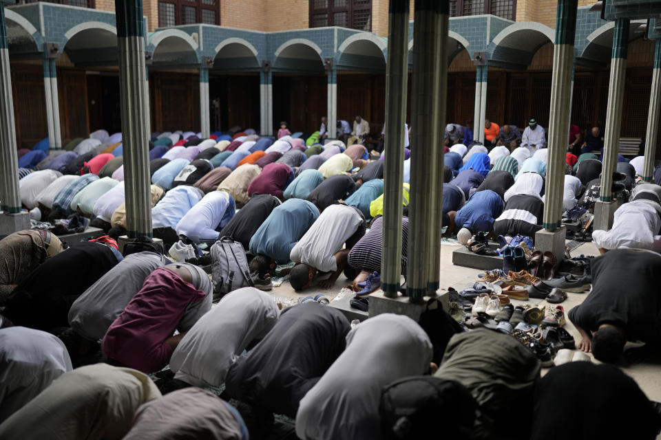 Men taking part in a prayer for peace fill the patio at the Central Mosque of Lisbon, in Lisbon, Friday, Oct. 13, 2023. The main mosque of the Portuguese Islamic community was completely full as worshippers gathered for their first Friday prayers since Hamas militants attacked Israel, igniting the latest Israel-Palestinian war. (AP Photo/Armando Franca)