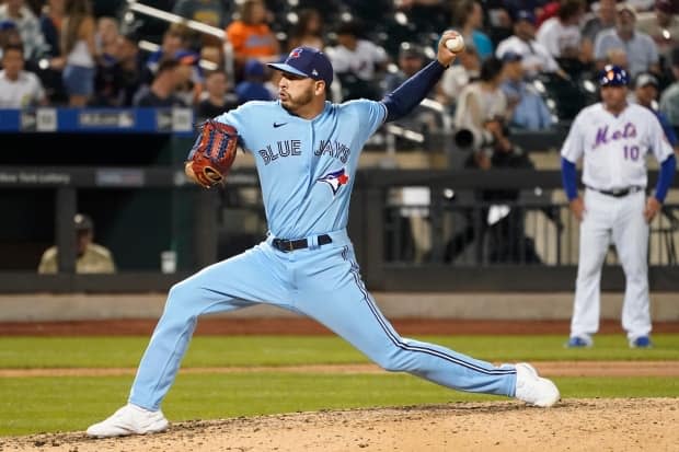 Toronto Blue Jays relief pitcher Tayler Saucedo delivered during the seventh inning of the team's baseball game against the New York Mets on Saturday, July 24. Baseball fans will soon be able to once again hear play-by-play dedicated radio broadcasts for the Blue Jays.  (Mary Altaffer/The Associated Press - image credit)