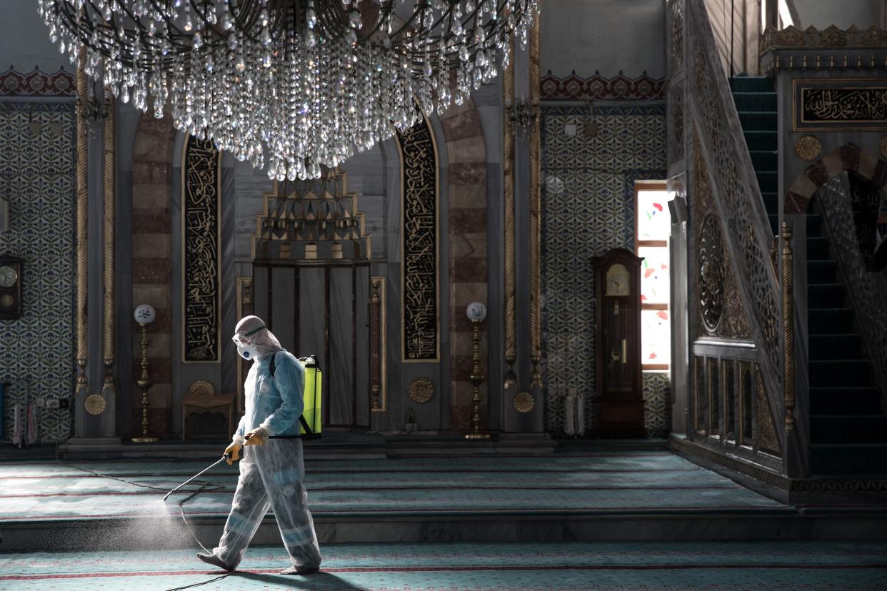 A worker from Istanbul Municipality disinfects a mosque to prevent the spread of the COVID-19, coronavirus ahead of Friday prayers on March 13, 2020 in Istanbul, Turkey.