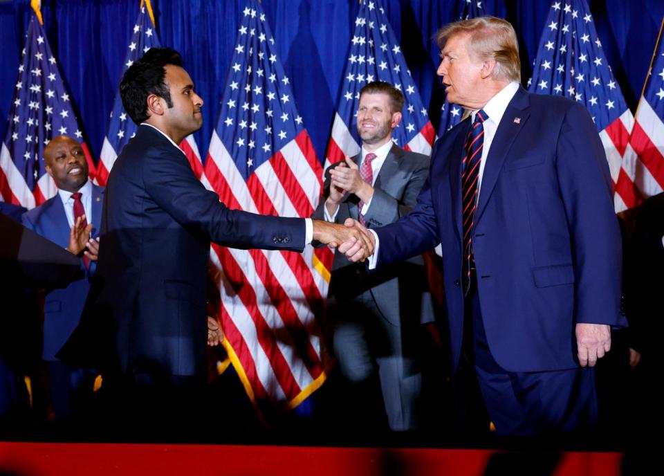 PHOTO: Republican presidential candidate and former President Donald Trump shakes hands with former Republican candidate Vivek Ramaswamy during Trump's primary night rally at the Sheraton on January 23, 2024 in Nashua, New Hampshire. (Chip Somodevilla/Getty Images)