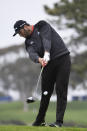 Jon Rahm, of Spain, hits his tee shot on the fifth hole of the South Course at Torrey Pines Golf Course during the final round of the Farmers Insurance golf tournament Sunday, Jan. 26, 2020, in San Diego. (AP Photo/Denis Poroy)