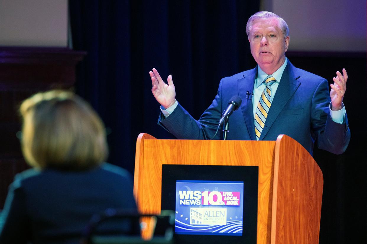 Lindsey Graham faces off in the South Carolina US Senate debate with Democratic challenger Jaime Harrison on 3 October 2020. (AP)