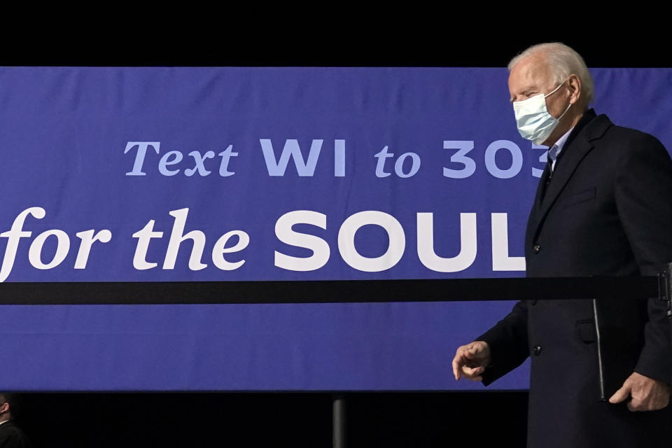 Democratic presidential candidate former Vice President Joe Biden walks from the podium after speaking in a hanger at General Mitchell International Airport, Friday, Oct. 30, 2020, in Milwaukee. (AP Photo/Andrew Harnik)